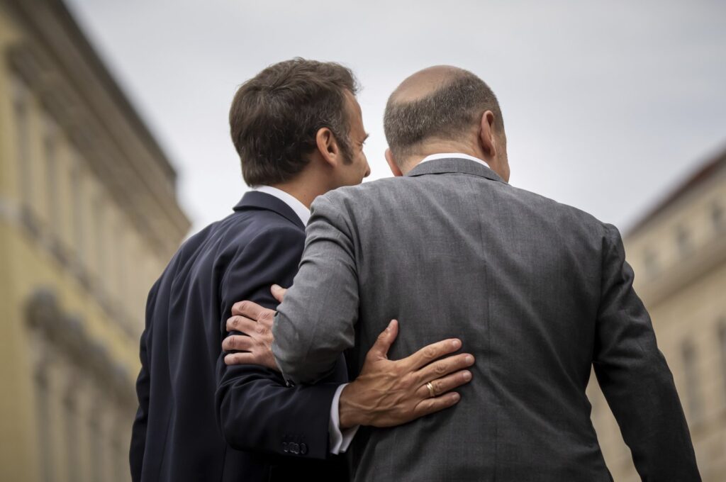 German Chancellor Olaf Scholz (R) welcomes French President Emmanuel Macron for a joint dinner in a restaurant in Potsdam near Berlin, Germany, June 6, 2023. (AP Photo)