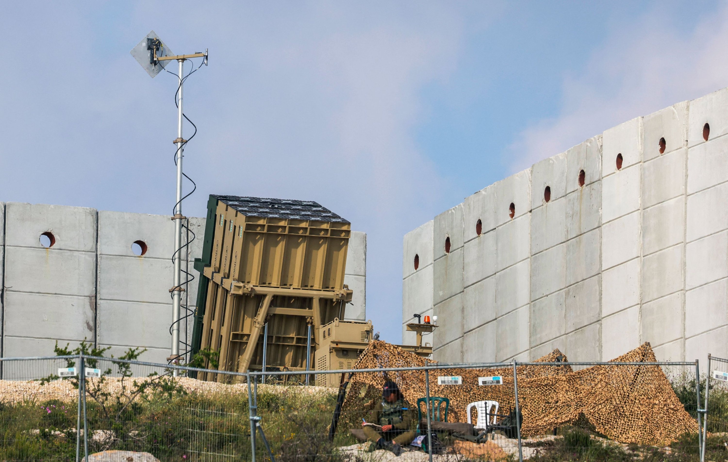 323773 An Israeli soldier takes up a position in front of a battery of an Iron Dome air defense system, East Jerusalem, occupied Palestine, April 15, 2024. (AFP Photo)