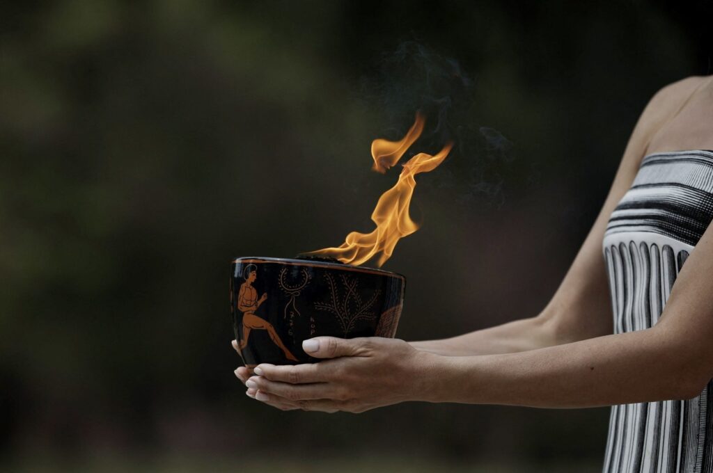 Greek actress Mary Mina, playing the role of High Priestess, carries the flame during the Olympic Flame lighting ceremony for the Paris 2024 Olympics, Ancient Olympia, Greece, April 16, 2024. (Reuters Photo)