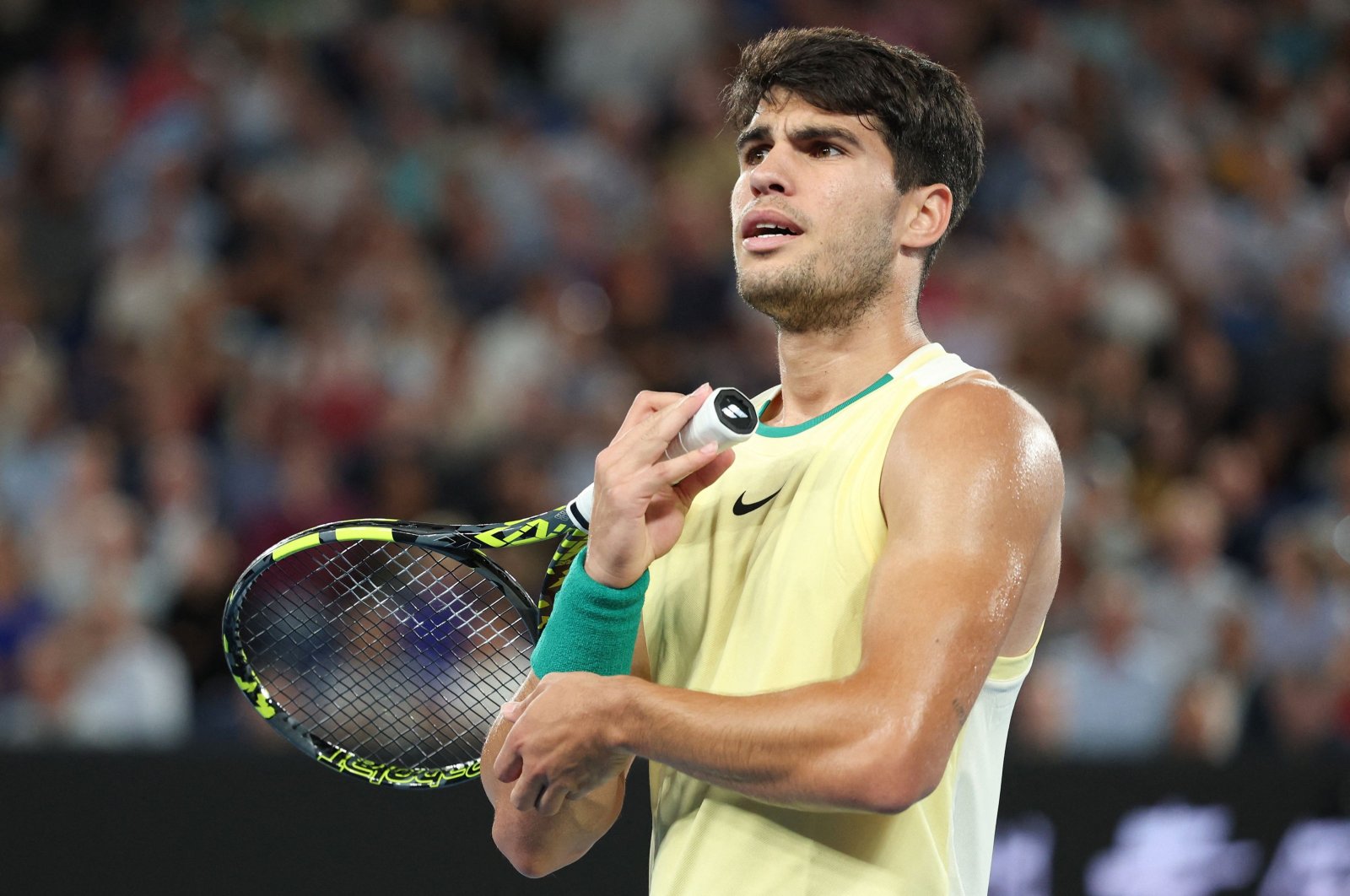 Spain's Carlos Alcaraz reacts after a point against Germany's Alexander Zverev during their men's singles quarterfinal match on Day 11 of the Australian Open, Melbourne, Australia, Jan. 24, 2024. (AFP Photo)