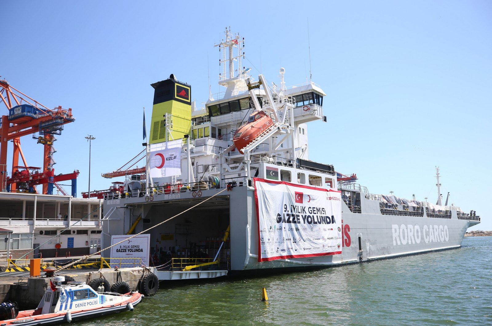 The Turkish Red Crescent loads humanitarian aid supplies onto a vessel for Gaza at the Port of Mersin, southern Mersin province, Türkiye, April 16, 2024. (AA Photo)