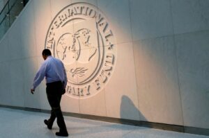 A man walks past the International Monetary Fund (IMF) logo at its headquarters in Washington, U.S., May 10, 2018. (Reuters Photo)
