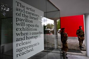 Italian soldiers stand guard in front of  Israel's pavilion during the pre-opening of the Venice Biennale art show, April 16, 2024. (AFP Photo)
