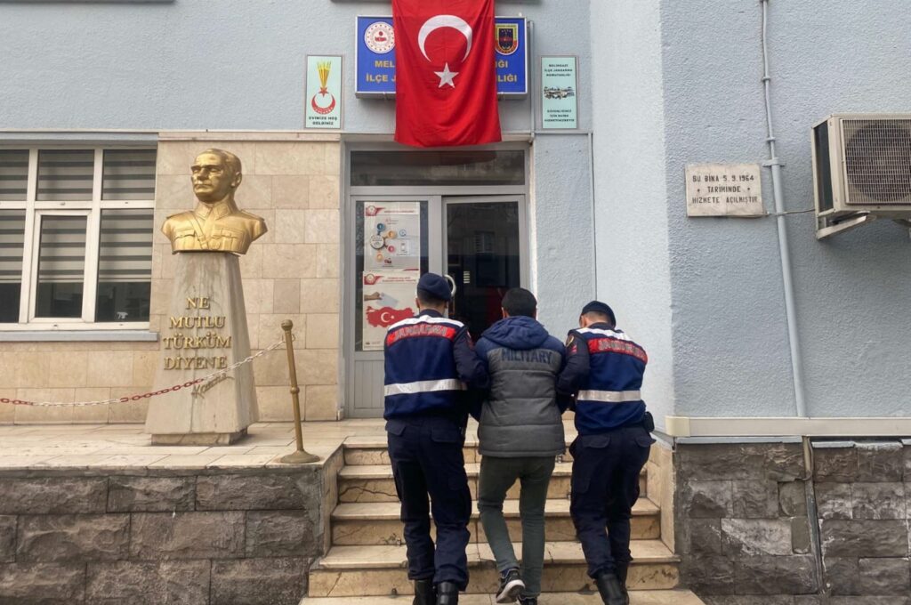 Two gendarmerie officers escort to the gendarmerie command a suspect with ties to the Daesh terrorist group, central Kayseri province, Türkiye, March 18, 2024. (AA Photo)