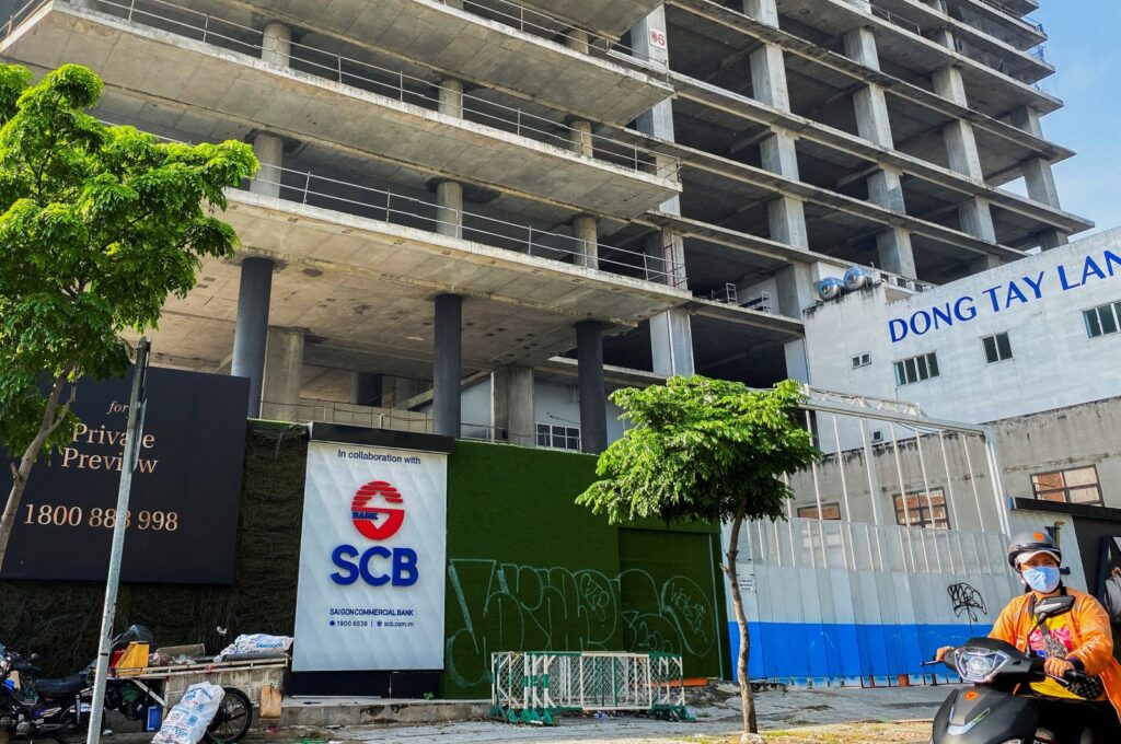 A logo of Saigon Joint Stock Commercial Bank (SCB) is seen in front of an under-construction building in Ho Chi Minh City, Vietnam, Nov. 30, 2023. (Reuters Photo)