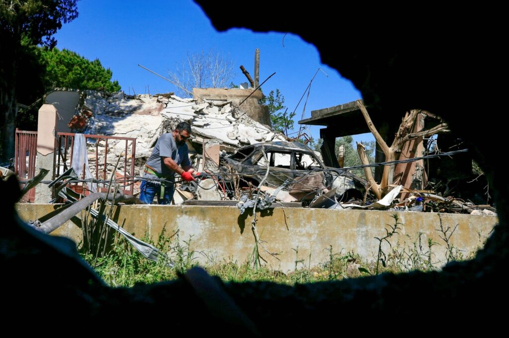 A technician repairs power lines damaged during Israeli strikes the previous day on the southern Lebanese village of Alma al-Shaab on April 17, 2024. (AFP Photo)