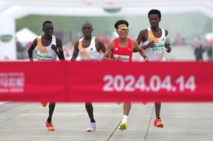 Chinese runner He Jie, Ethiopian Dejene Hailu Bikila and Kenyans Robert Keter and Willy Mnangat take part in a half-marathon, Beijing, China, April 14, 2024. (Reuters Photo)