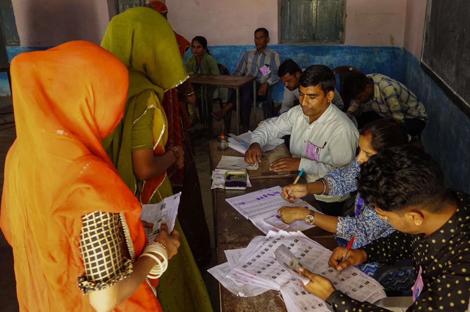 Women arrive to cast their ballot at a polling station in the first phase of voting for the India's general elections in Parbatsar, Rajasthan, India, April 19, 2024. (AFP Photo)