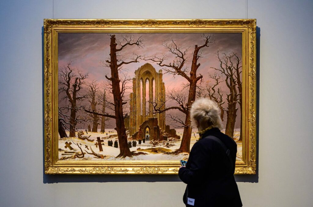 The painting "Monastery Cemetery in Snow," a copy by an unknown artist of a painting by German painter Caspar David Friedrich (1774-1840), is on display as part of the "Infinite Landscapes" exhibition at the Alte Nationalgalerie museum, Berlin, Germany, April 17, 2024. (AFP Photo)