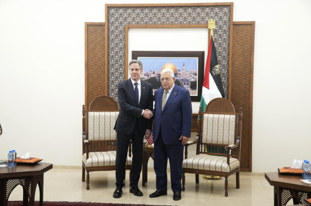 U.S. Secretary of State Antony Blinken, center left, and Palestinian President Mahmoud Abbas shake hands during their meeting in the West Bank town of Ramallah, Wednesday, Feb. 7, 2024. (AP File Photo)