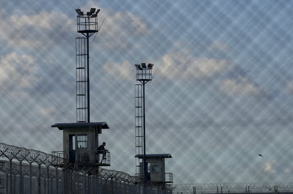 A prison guard sits in a watchtower at the Pinero jail, Pinero, Argentina, April 9, 2024. (AP Photo)