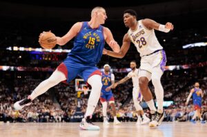 Denver Nuggets Nikola Jokic (L) drives to the basket against Los Angeles Lakers Rui Hachimura during the second quarter in game one of the first round for the 2024 NBA playoffs at Ball Arena, Denver, Colorado, U.S., April 20, 2024. (Reuters Photo)