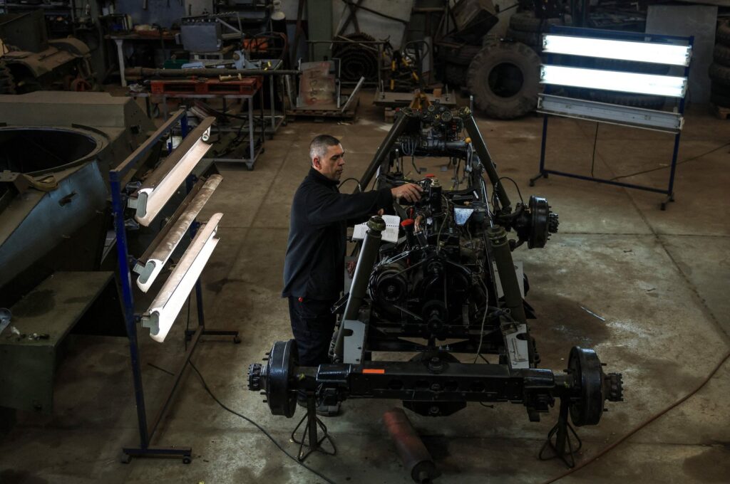 Portuguese Association of Old Military Vehicles’ technician Jose Nascimento, works on the restoration of a Humber military vehicle at a military warehouse in Oeiras, Portugal, March 26, 2024. (AFP Photo)