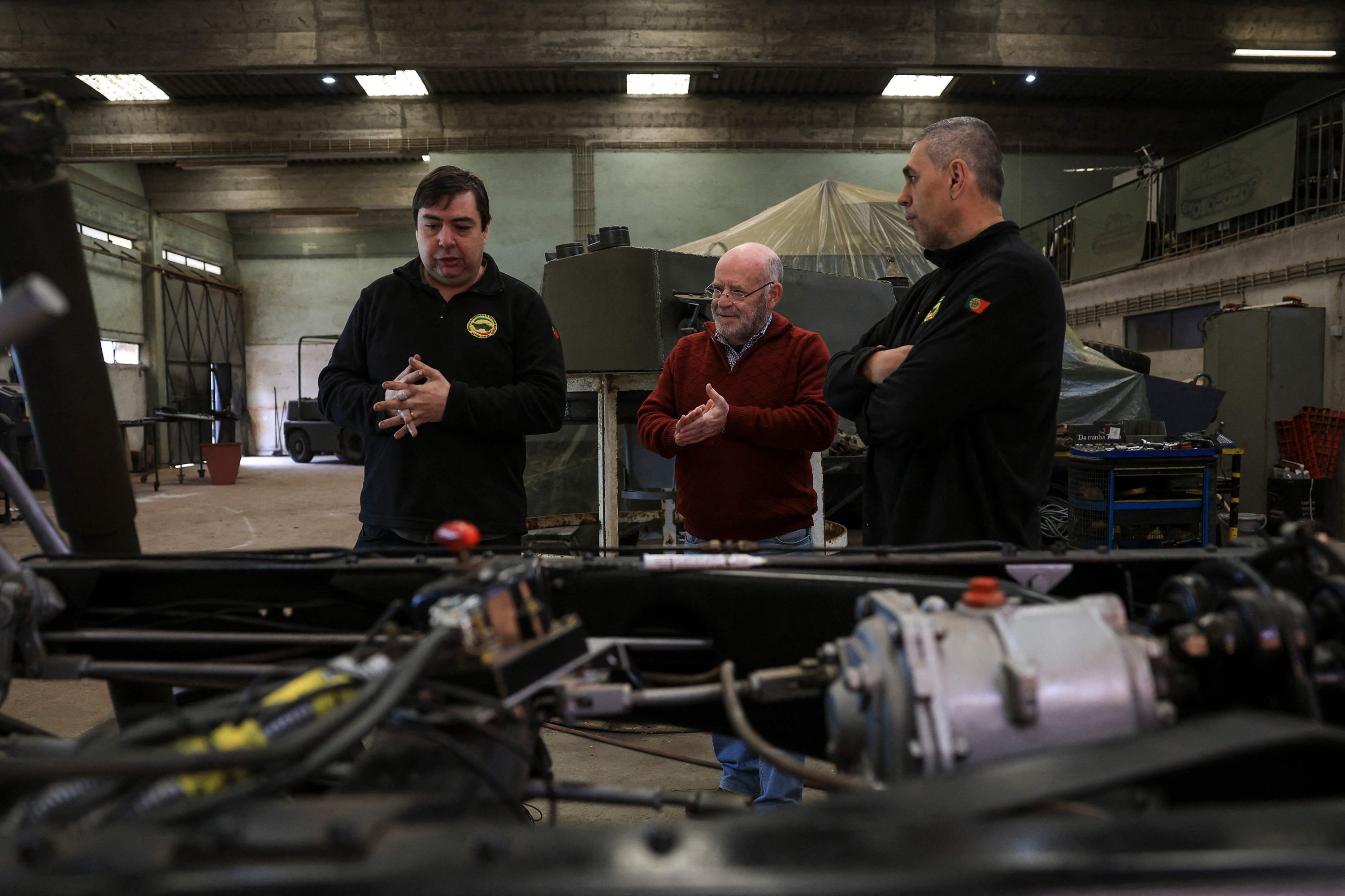 324606 The military chief during the 1974 Carnation Revolution, Jose Afonso Pedrosa de Oliveira (C), takes a look at a Humber military vehicle, Oeiras, Portugal, March 26, 2024. (AFP Photo)
