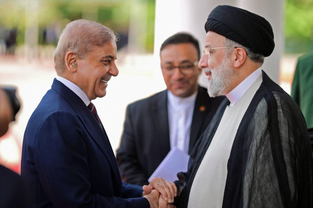 Iran’s President Ebrahim Raisi (R) being greeted by Pakistan's Prime Minister Shehbaz Sharif in Islamabad, Pakistan, April 22, 2024. (AFP Photo)
