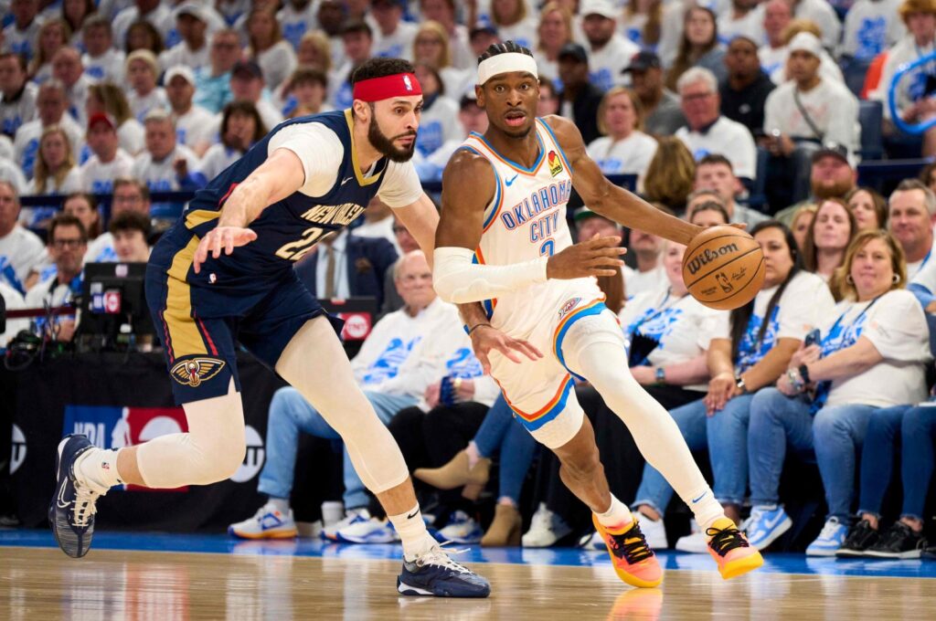 Thunder's Shai Gilgeous-Alexander (R) brings the ball up court against Pelicans in an NBA Playoffs game, in Oklahoma City, U.S., April 21, 2024. (AFP Photo)