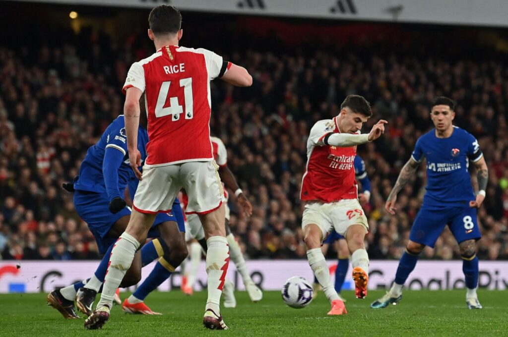 Arsenal's Kai Havertz (2nd R) shoots to score their fourth goal during the English Premier League football match against Chelsea at the Emirates Stadium, London, U.K., April 23, 2024. (AFP Photo)