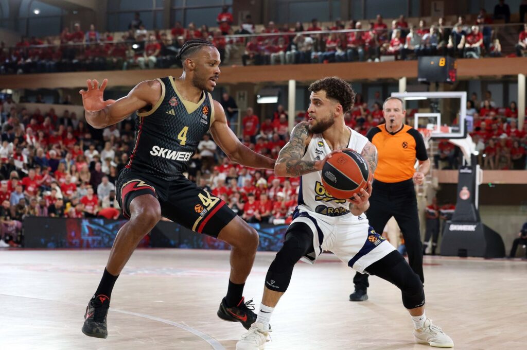 Fenerbahçe Beko's Scottie Wilbekin (R) in action with Monaco's Jaron Blossomgame during the Turkish Airlines EuroLeague playoff series opener at the Salle Gaston Medecin, Monaco, Monaco, April 24, 2024. (IHA Photo)