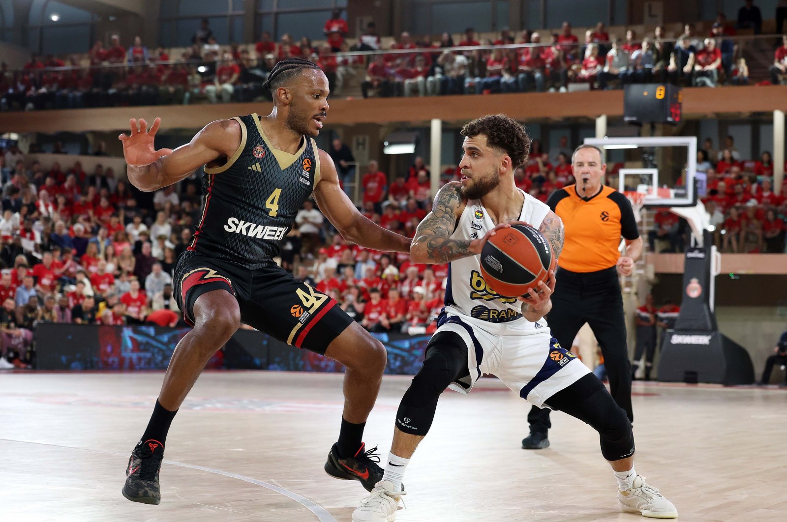 Fenerbahçe Beko's Scottie Wilbekin (R) in action with Monaco's Jaron Blossomgame during the Turkish Airlines EuroLeague playoff series opener at the Salle Gaston Medecin, Monaco, Monaco, April 24, 2024. (IHA Photo)