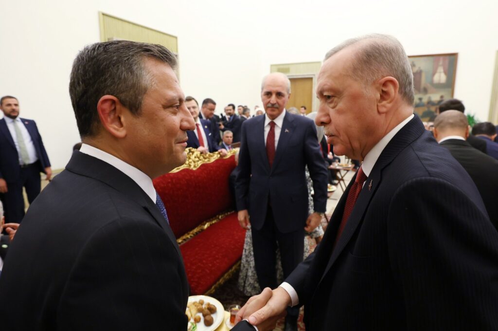 President Recep Tayyip Erdoğan (R) shakes hands with Republican People's Party (CHP) Chair Özgür Özel (L) as they attend a public holiday reception hosted by Parliament Speaker Numan Kurtulmuş (C), Ankara, Türkiye, April 23, 2024. (AA Photo)