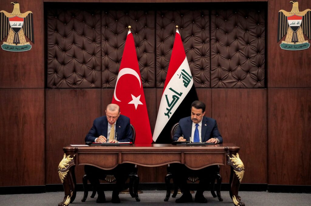 President Recep Tayyip Erdoğan (L) and Iraq's Prime Minister Mohammed S. Al Sudani sign mutual agreements during their meeting, Baghdad, Iraq, April 22, 2024. (Reuters Photo)