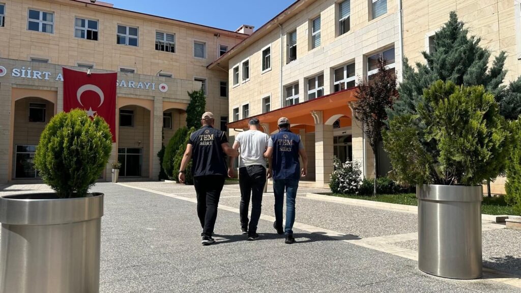 Police officers escort a captured FETÖ suspect, Siirt, eastern Türkiye, April 30, 2024. (İHA Photo)