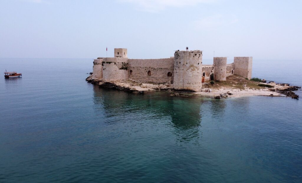 As temperatures rise, holidaymakers flock to tranquil Kızkalesi as the sea hits 23°C, Mersin, Türkiye. (IHA Photo)