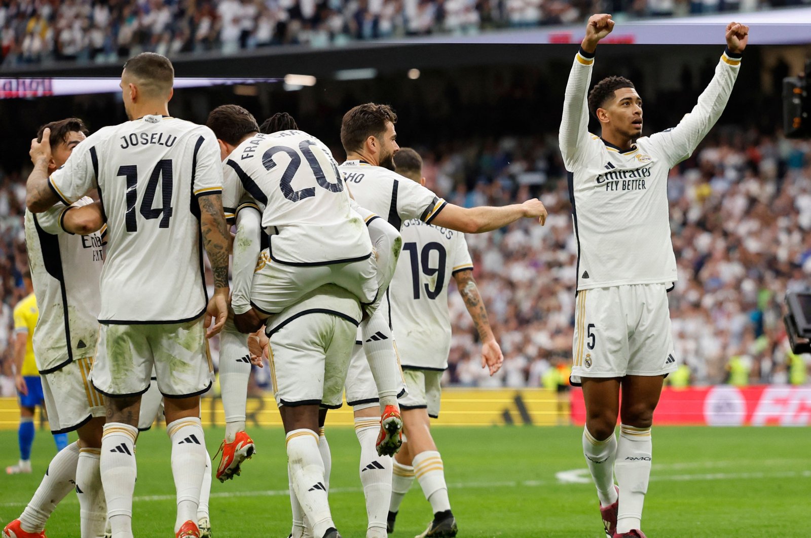 Real Madrid's (R) Jude Bellingham celebrates scoring his team's second goal during the La Liga match against Cadiz at the Santiago Bernabeu stadium, Madrid, Spain, May 4, 2024. (AFP Photo)