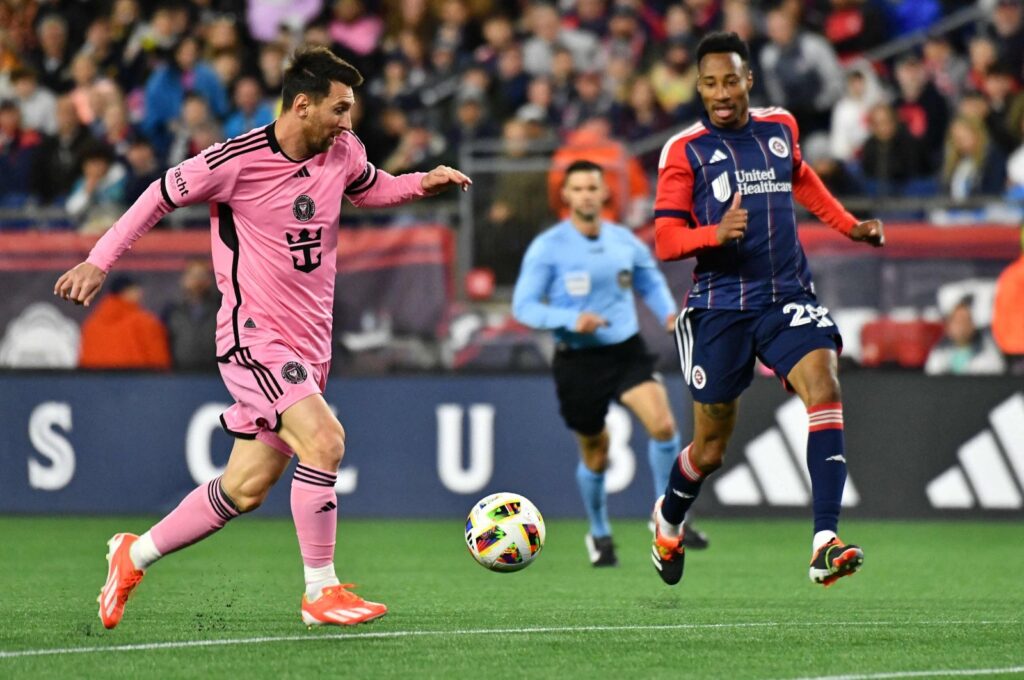 Inter Miami's Lionel Messi (L) fights for the ball with New England Revolution's Mark-Anthony Kaye during the Major League Soccer (MLS) match at Gillette Stadium, Foxborough, Massachusetts, U.S., April 27, 2024. (AFP Photo)
