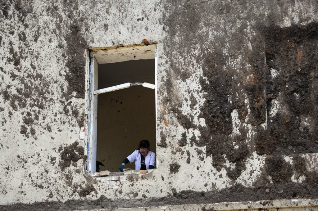 A medical worker clears debris following a rocket attack on a regional psychiatric hospital in Kharkiv, northeastern Ukraine, April 27, 2024. (EPA Photo)