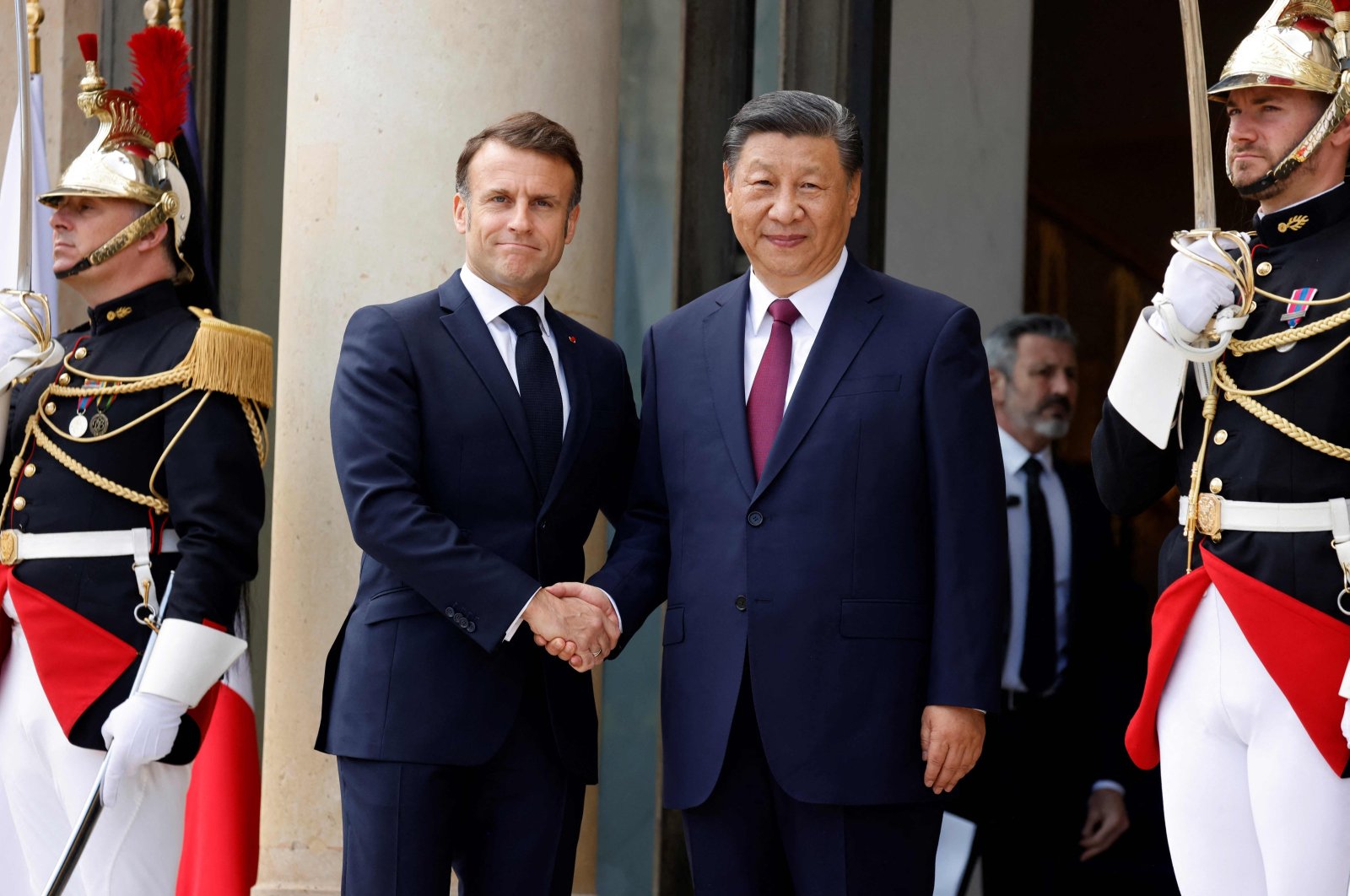 France's President Emmanuel Macron (L) greets Chinese President Xi Jinping at The Elysee Presidential Palace in Paris, France, May 6, 2024. (AFP Photo)