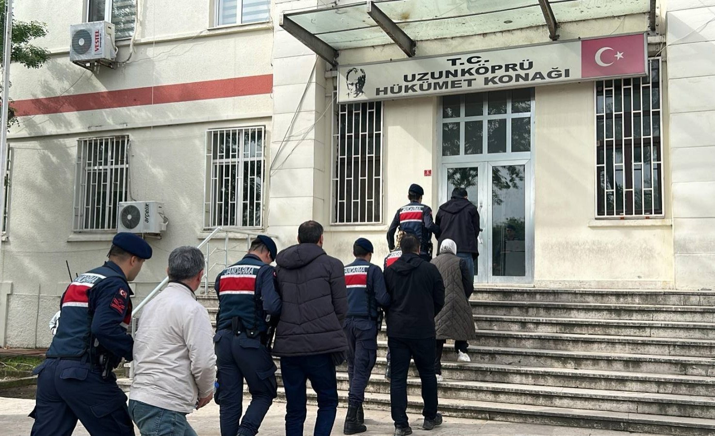 Turkish gendarmerie officers escort to a government office five FETÖ suspects caught while trying to flee the country in the northwestern Edirne province, Türkiye, May 5, 2024. (DHA Photo)