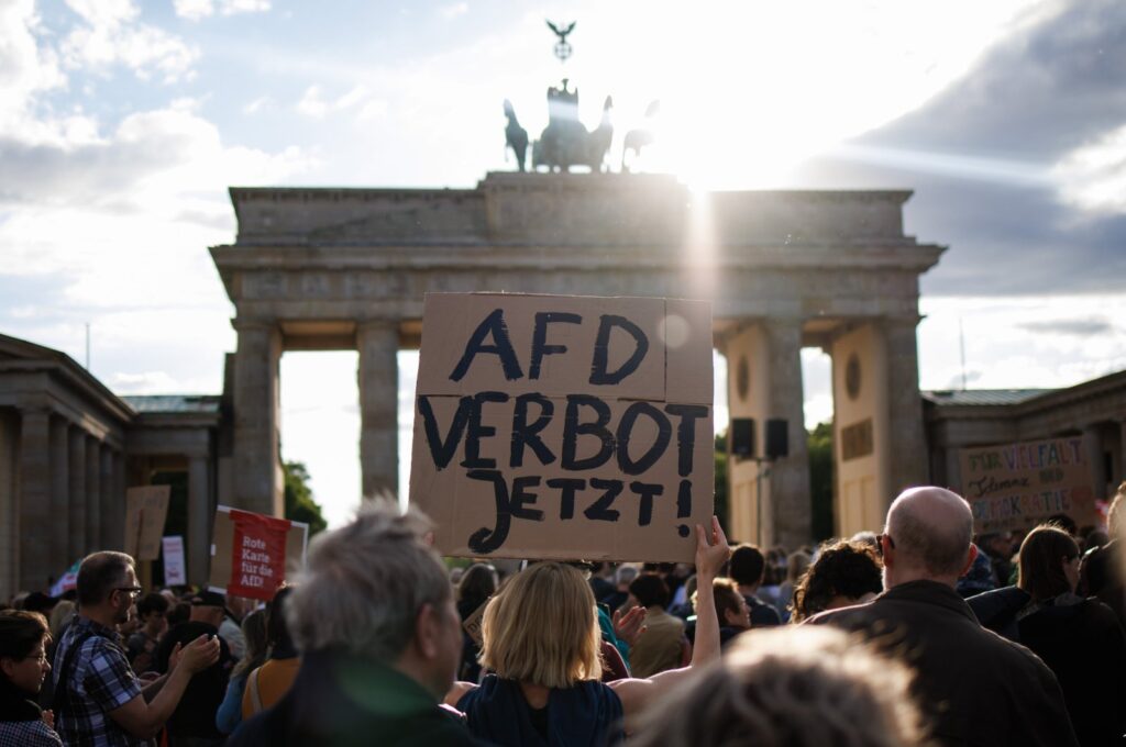 A participant holds a placard reading "AFD ban now!" referring to the far-right Alternative for Germany (AfD) party, during a rally in reaction to attacks on campaigning politicians in Germany, Berlin, Germany, May 5, 2024. (EPA Photo)