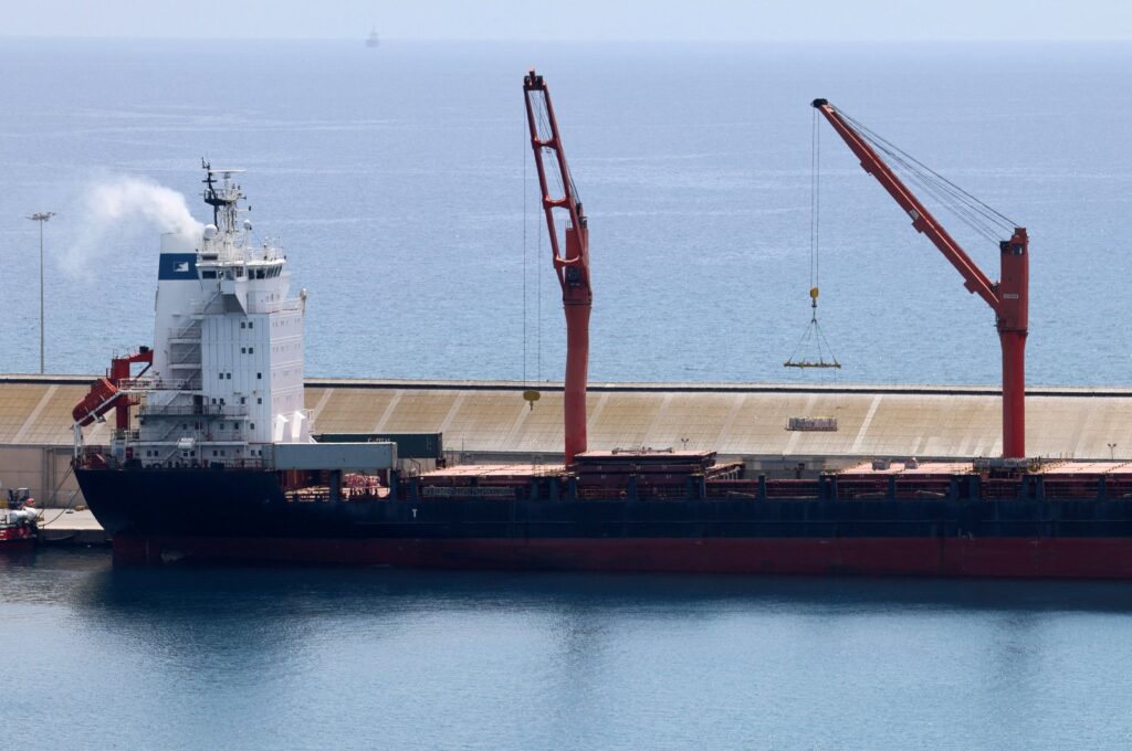 A crane lifts material onto a cargo vessel expected to take aid to Gaza, at the port of Larnaca, Greek Cyprus, May 8, 2024. (Reuters Photo)