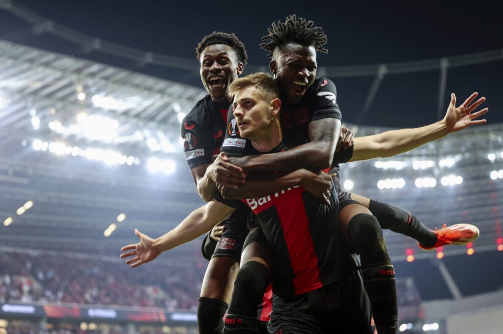 Bayer Leverkusen's Josip Stanisic (C) celebrates with teammates after scoring the 2-2 equalizer during the UEFA Europa League semifinal second leg match between against Roma, Leverkusen, Germany, May 9, 2024. (EPA Photo)