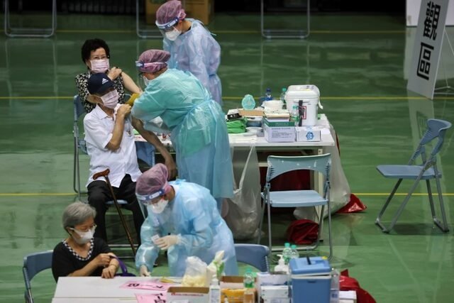 People receive a vaccine against the COVID-19 pandemic during a vaccination session for elderly people over 85 years old, at a sports stadium in New Taipei City, Taiwan, June 15, 2021. (Reuters Photo)