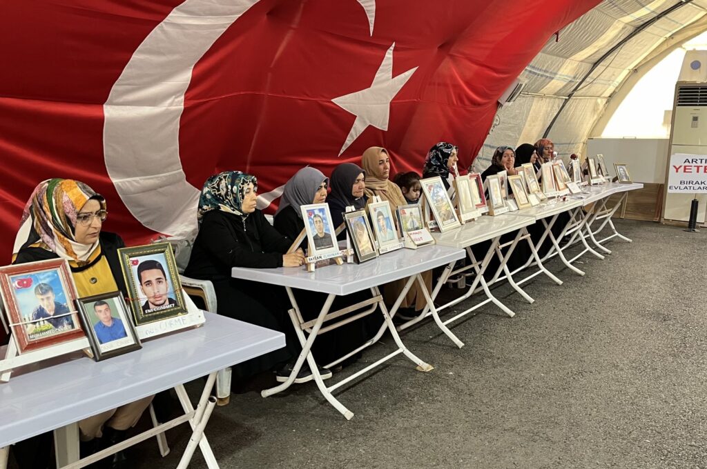 The "Diyarbakır Mothers" pose with photos of their children abducted by the PKK, Diyarbakır, southeastern Türkiye, May 12, 2024. (DHA Photo)