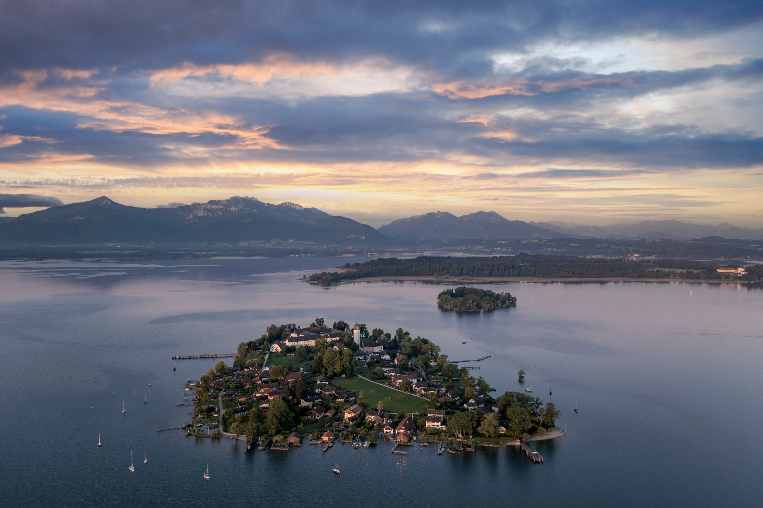 327611 Chiemsee, Bavaria's largest lake, and the trio of islands nestled within its waters: Herreninsel, Fraueninsel and Krautinsek, Bavaria, Germany. (Shutterstock Photo)