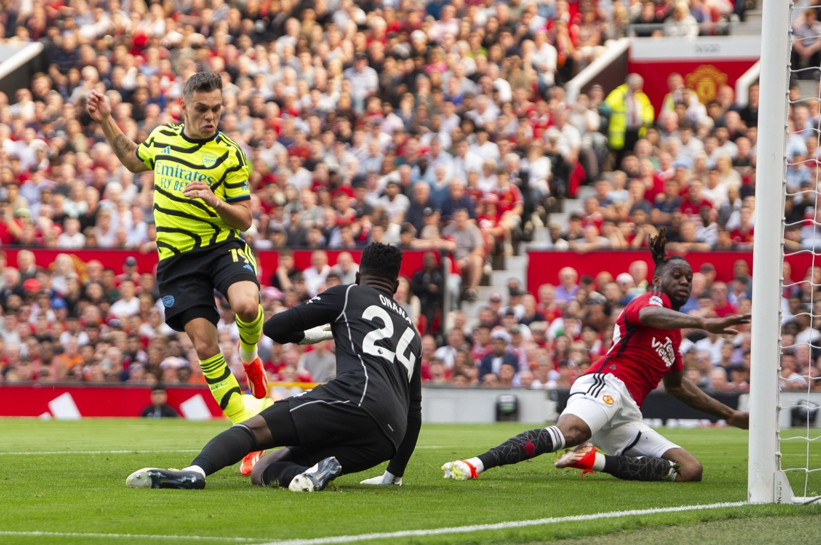 Arsenal's Leandro Trossard (L) scores the 0-1 goal against goalkeeper Manchester United's Andre Onana (C) during the English Premier League match, Manchester, U.K., May 12, 2024. (EPA Photo)