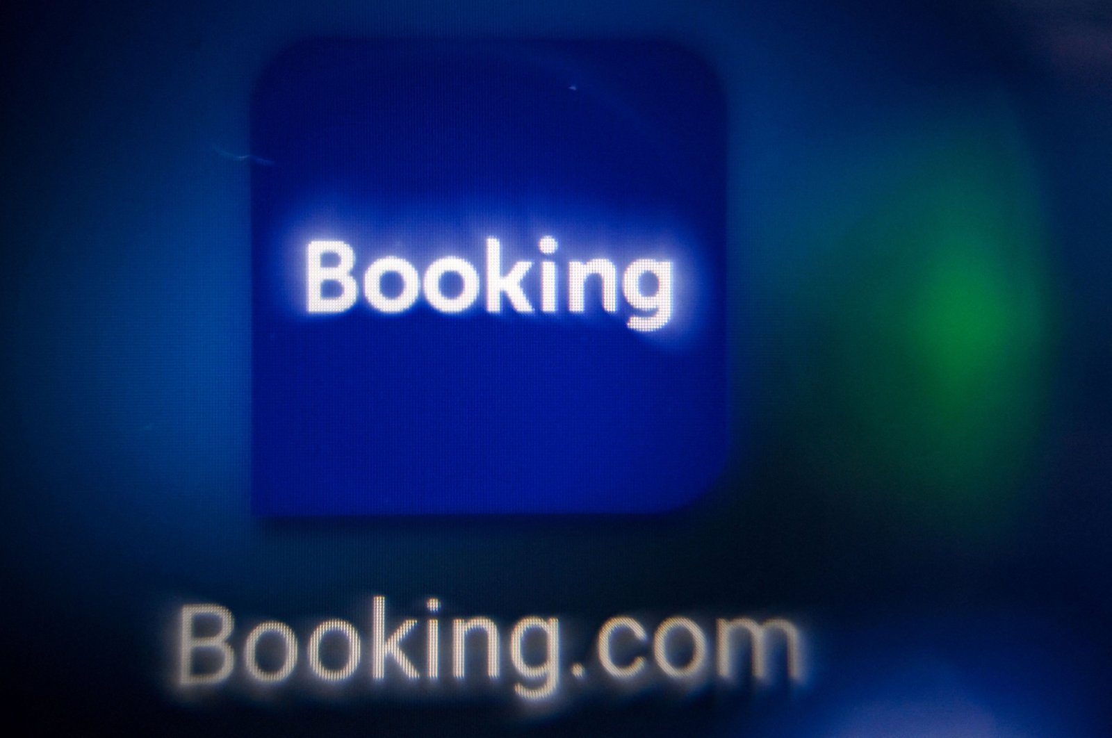 This picture shows the logo of the online reservation platform Booking.com on a tablet screen, Moscow, Russia, Nov. 11, 2021. (AFP Photo)