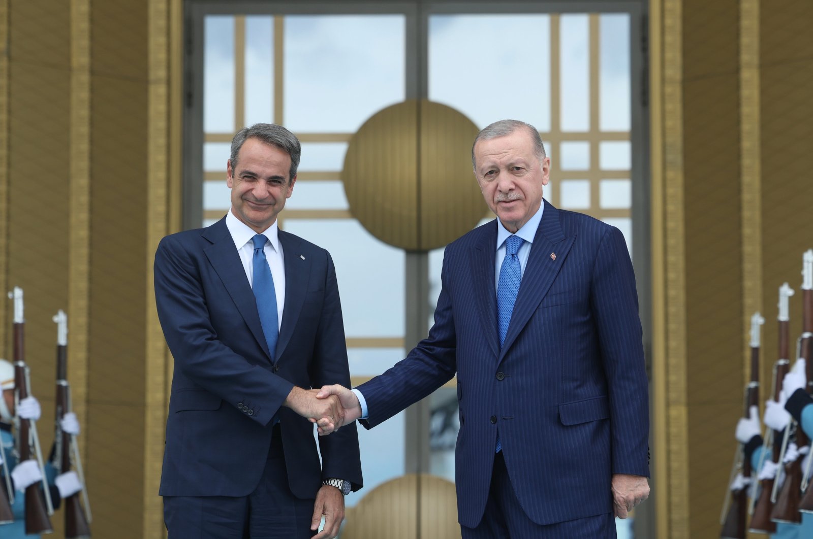 A handout photo made available by the Turkish President Press Office shows, President Recep Tayyip Erdoğan (R) and Greek Prime Minister Kyriakos Mitsotakis (L) posing for a photograph during a welcome ceremony before their meeting at the Presidential Complex in Ankara, May 13, 2024. (EPA Photo)