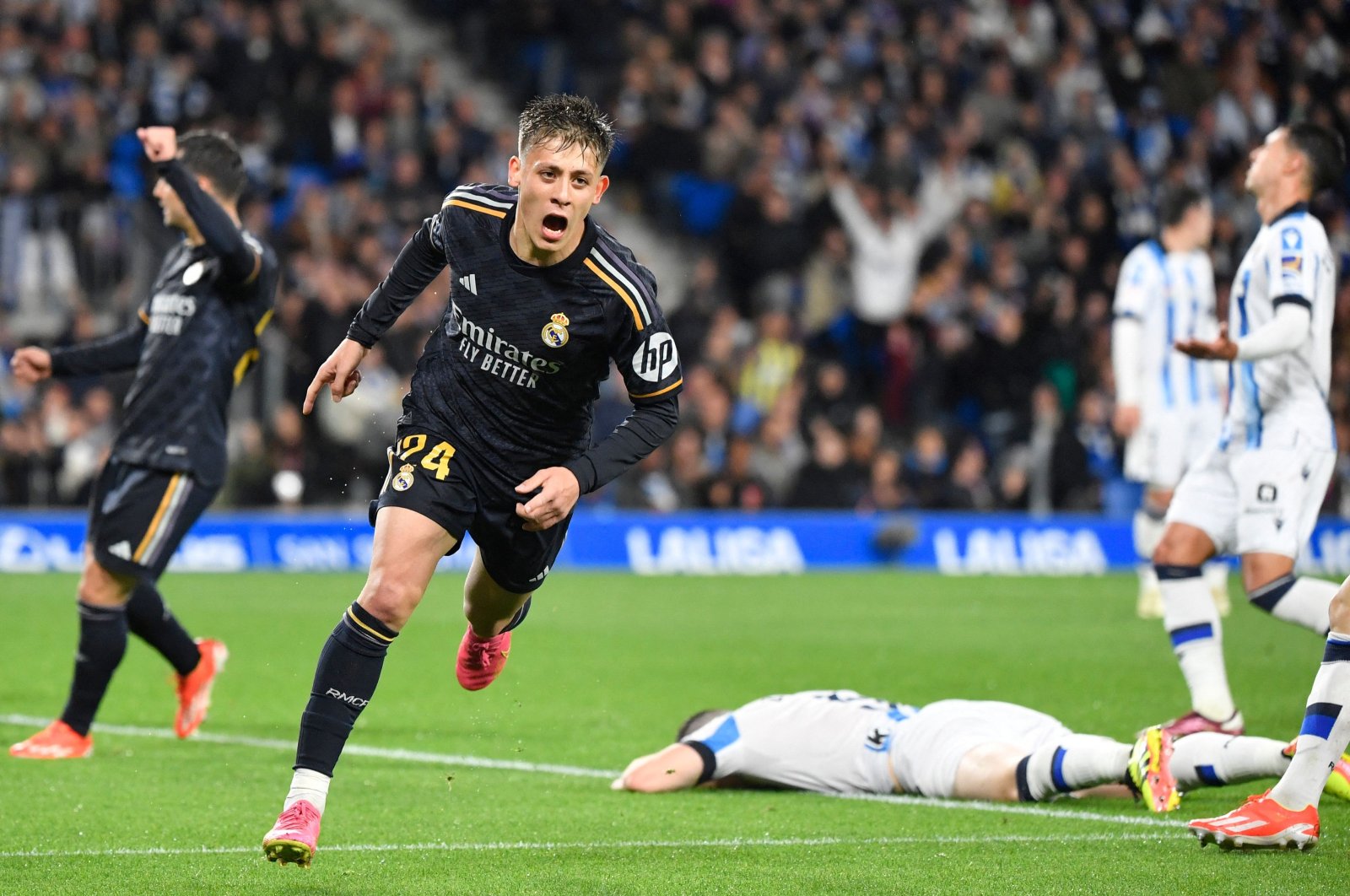 Real Madrid's Arda Güler celebrates scoring his team's first goal during the Spanish league football match against Real Sociedad, at the Anoeta stadium, San Sebastian, Spain, April 26, 2024. (AFP Photo)