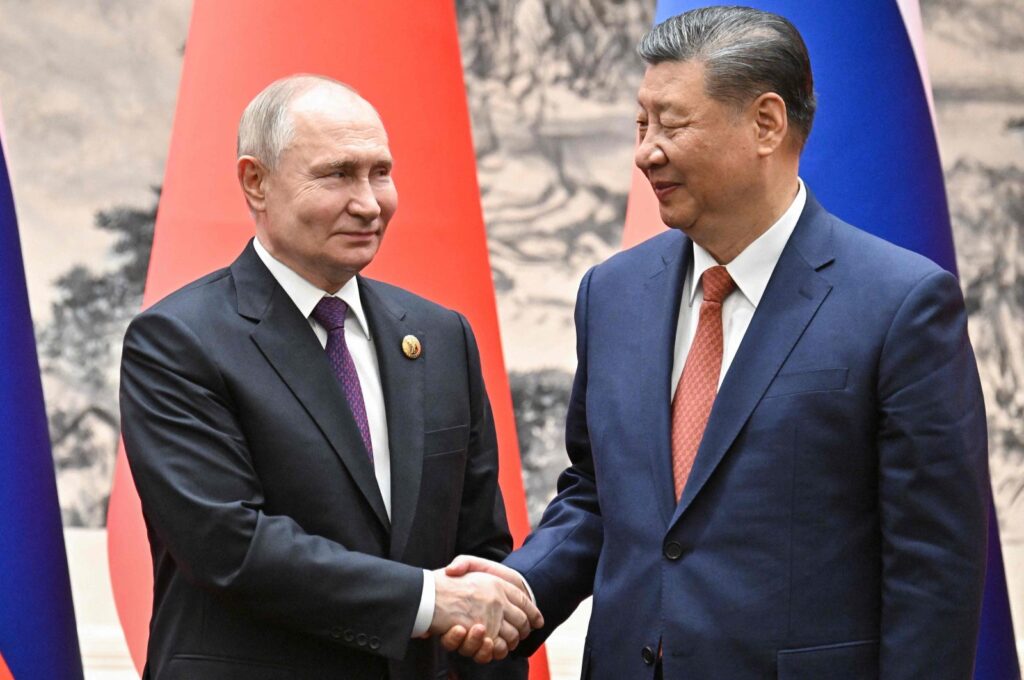 Russia's President Vladimir Putin (L) and China's President Xi Jinping shake hands in Beijing, China, May 16, 2024. (AFP Photo)