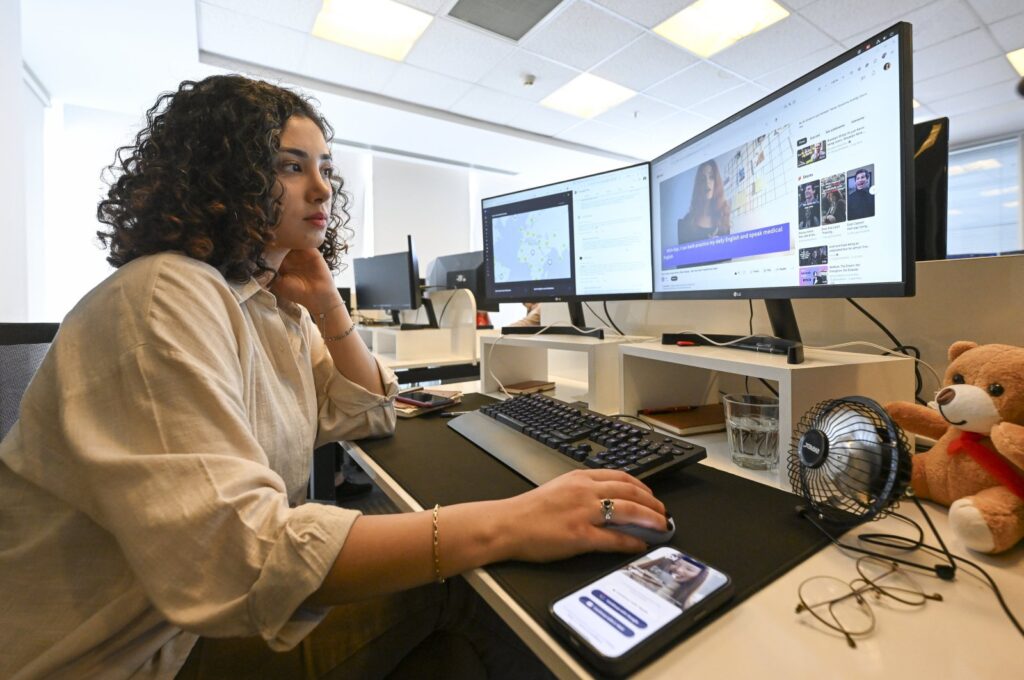 Nisanur Genç sits in her workspace where she serves as the product manager for the Gipi application, Istanbul, Türkiye, May 17, 2024. (AA Photo)