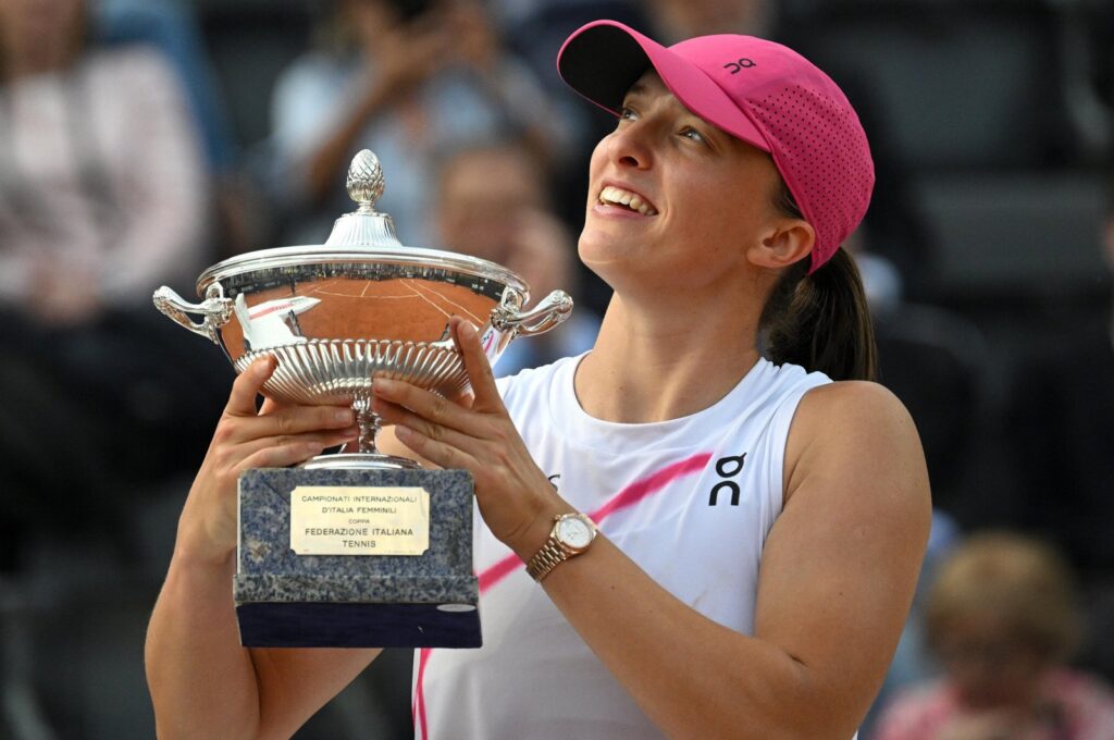 Iga Swiatek poses with her trophy after winning her women's final match against Aryna Sabalenka at the Italian Open, Rome, Italy, May 18, 2024. (EPA Photo)