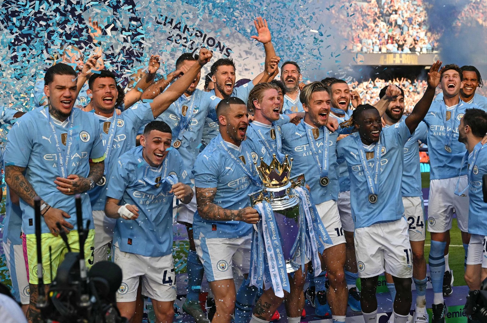 Manchester City's players celebrate after clinching the Premier League title at the Etihad Stadium, Manchester, U.K., May 19, 2024. (AFP Photo)