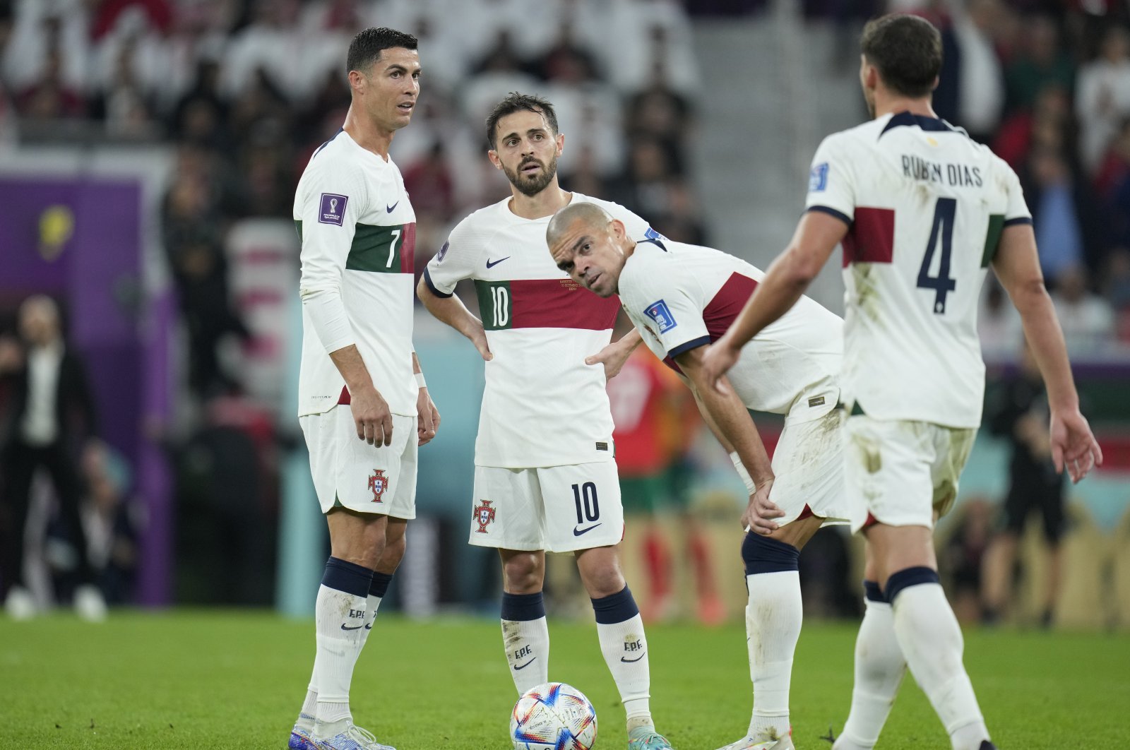 (L-R) Portugal's Cristiano Ronaldo, Bernardo Silva, Pepe and Ruben Dias prepare for a free kick during the World Cup quarterfinal match against Morocco, at Al Thumama Stadium, Doha, Qatar, Dec. 10, 2022. (AP Photo)