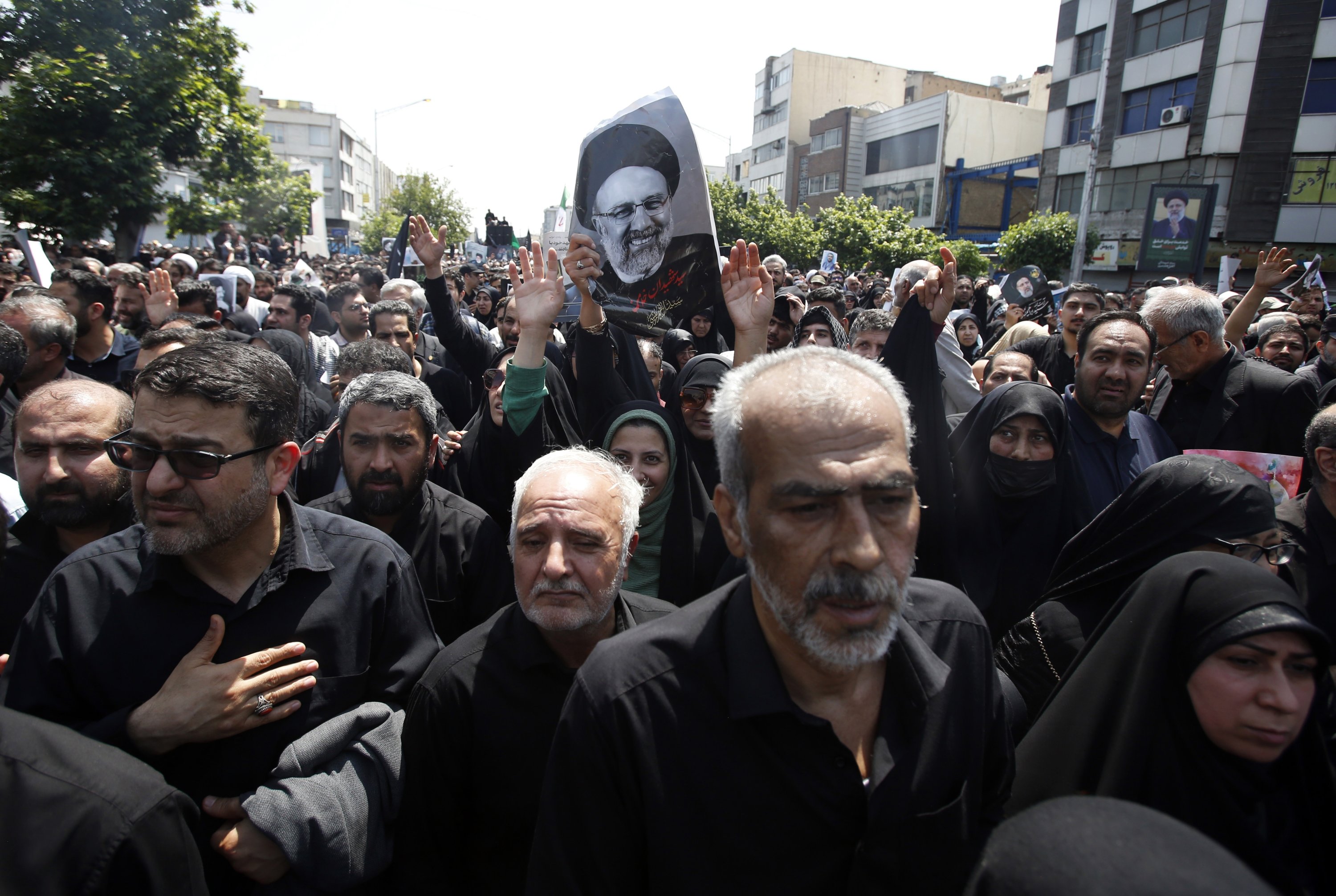 329160 Iranians, with portraits of Ebrahim Raisi, take part in a funeral ceremony in Tehran, Iran, May 22, 2024. (EPA Photo)
