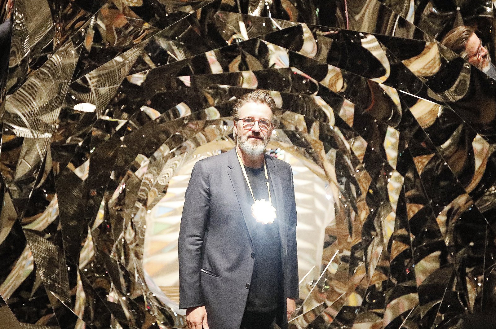 Olafur Eliasson poses at the installation "Your Spiral View" as part of the exhibition Olafur Eliasson: "In real life" at the Tate Modern Gallery in London, U.K., July 9, 2019. (AP Photo)