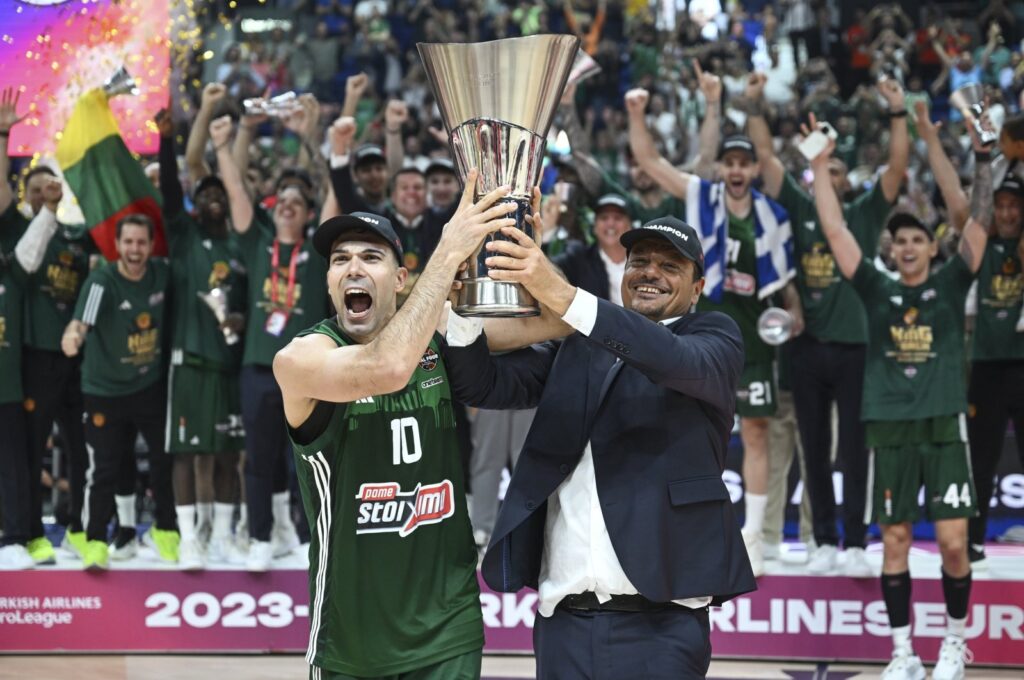Panathinaikos' captain Kostas Sloukas (L) and coach Ergin Ataman raise the EuroLeague trophy after beating Real Madrid in the final, Berlin, Germany, May 26, 2024. (AA Photo)